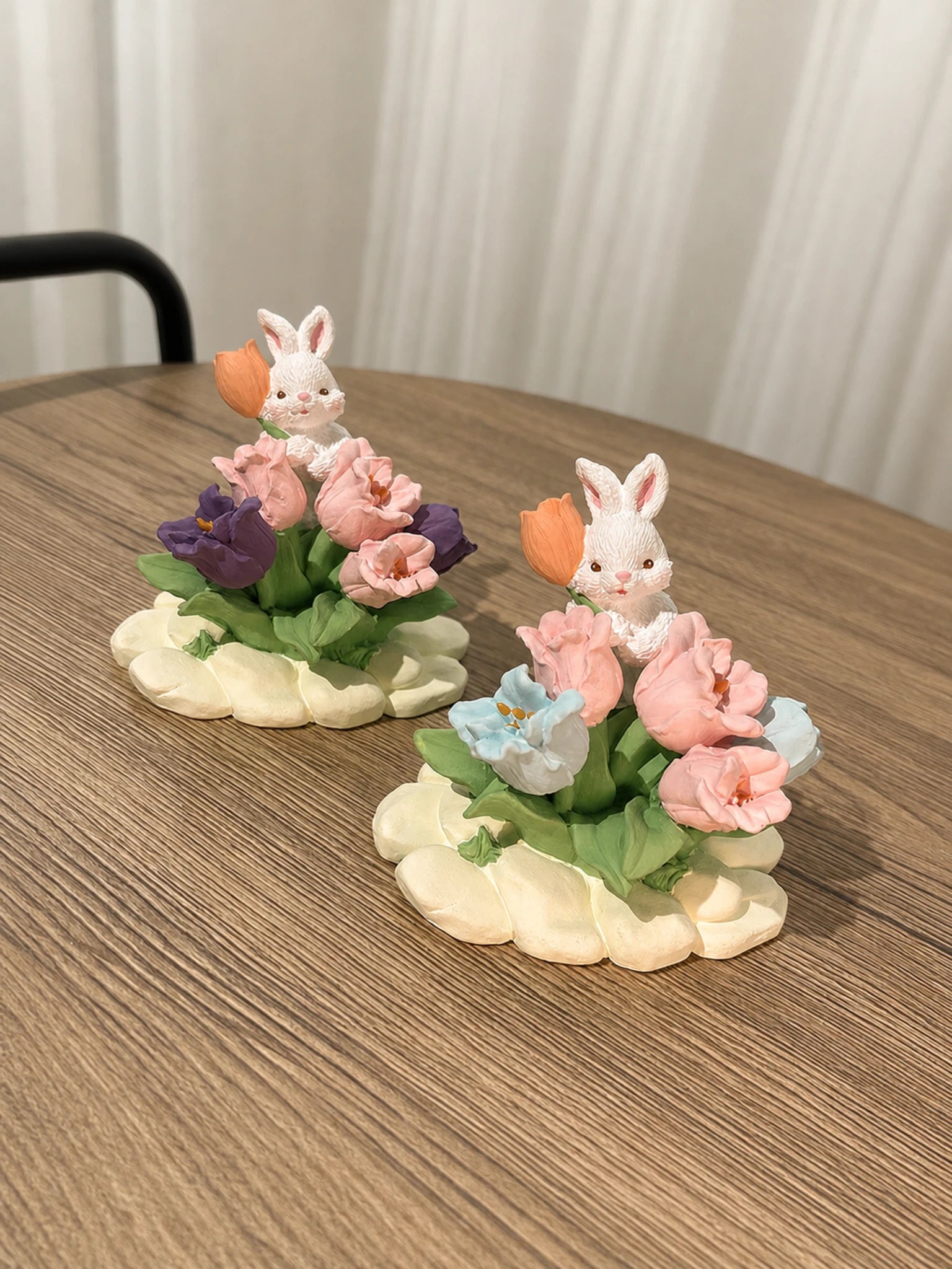 Two Tulip Rabbit Garden dashboard ornaments on a clean neutral background