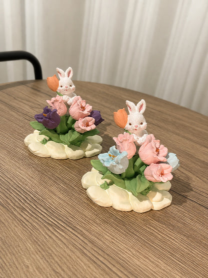 Two Tulip Rabbit Garden dashboard ornaments on a clean neutral background