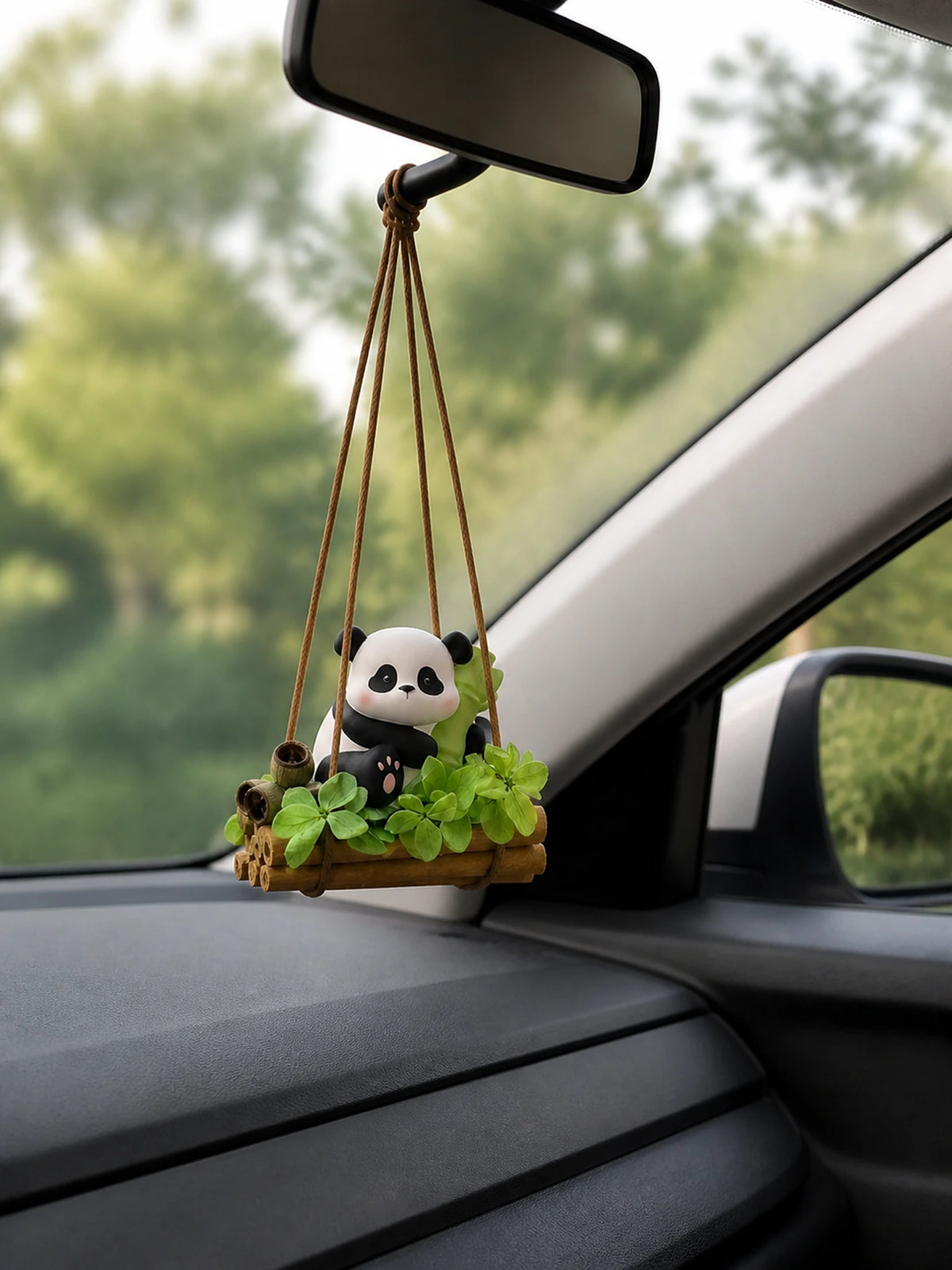 Bamboo Panda car charm hanging naturally below a rearview mirror