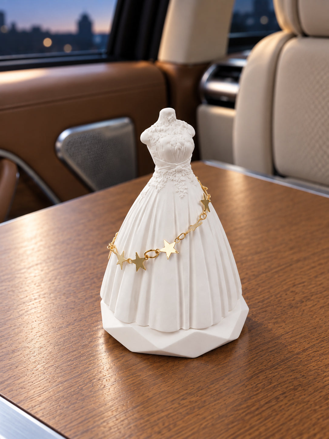 Three-quarter view of the bridal silhouette on a level Range Rover SV rear table at dusk while parked