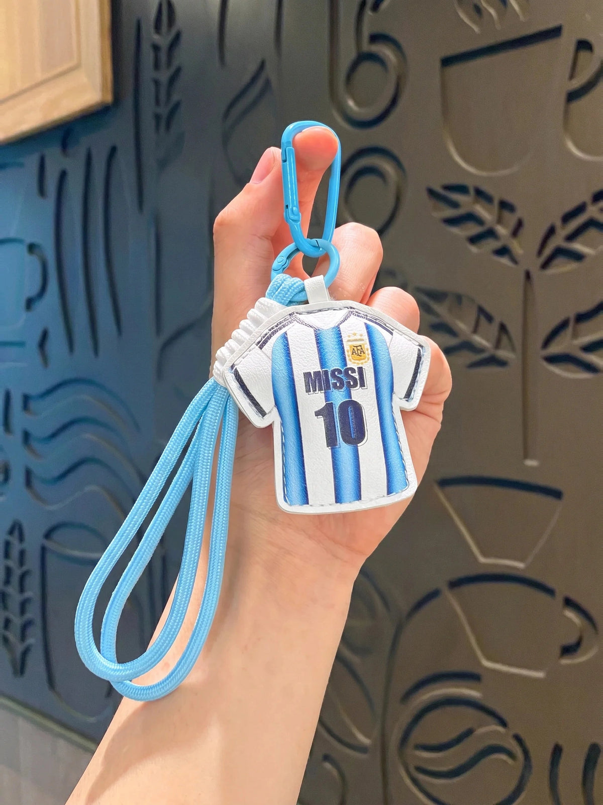 Light blue and white stripe jersey style keychain variant