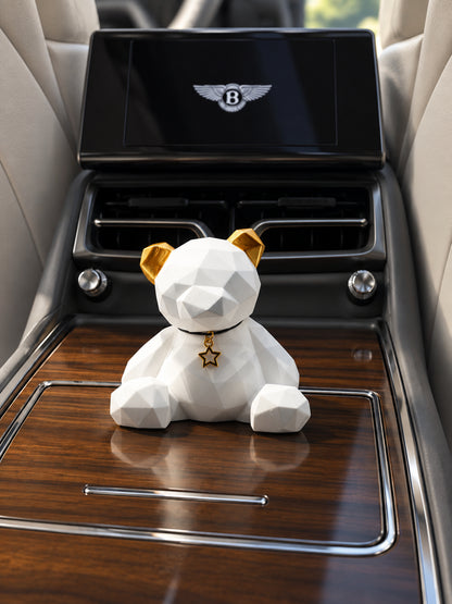 Golden Ear Bear on the closed wood lid of a parked Bentley Flying Spur rear console