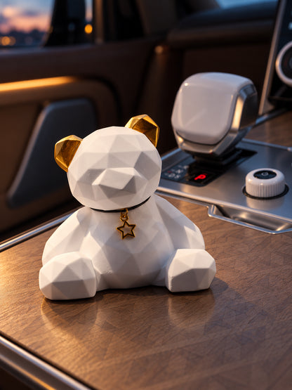 Golden Ear Bear on a level closed wood console lid in a parked Range Rover SV at dusk