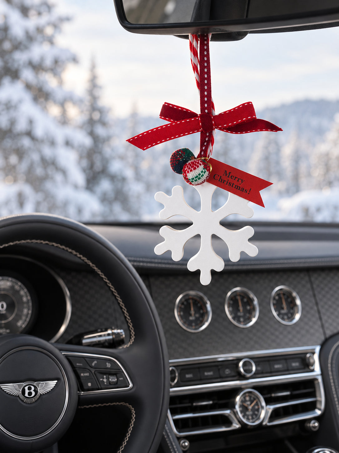 White snowflake ornament below the rearview mirror in a parked Bentley Flying Spur