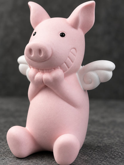 Close view of the Wish Pig's white curled wing, carved smile and clasped hands